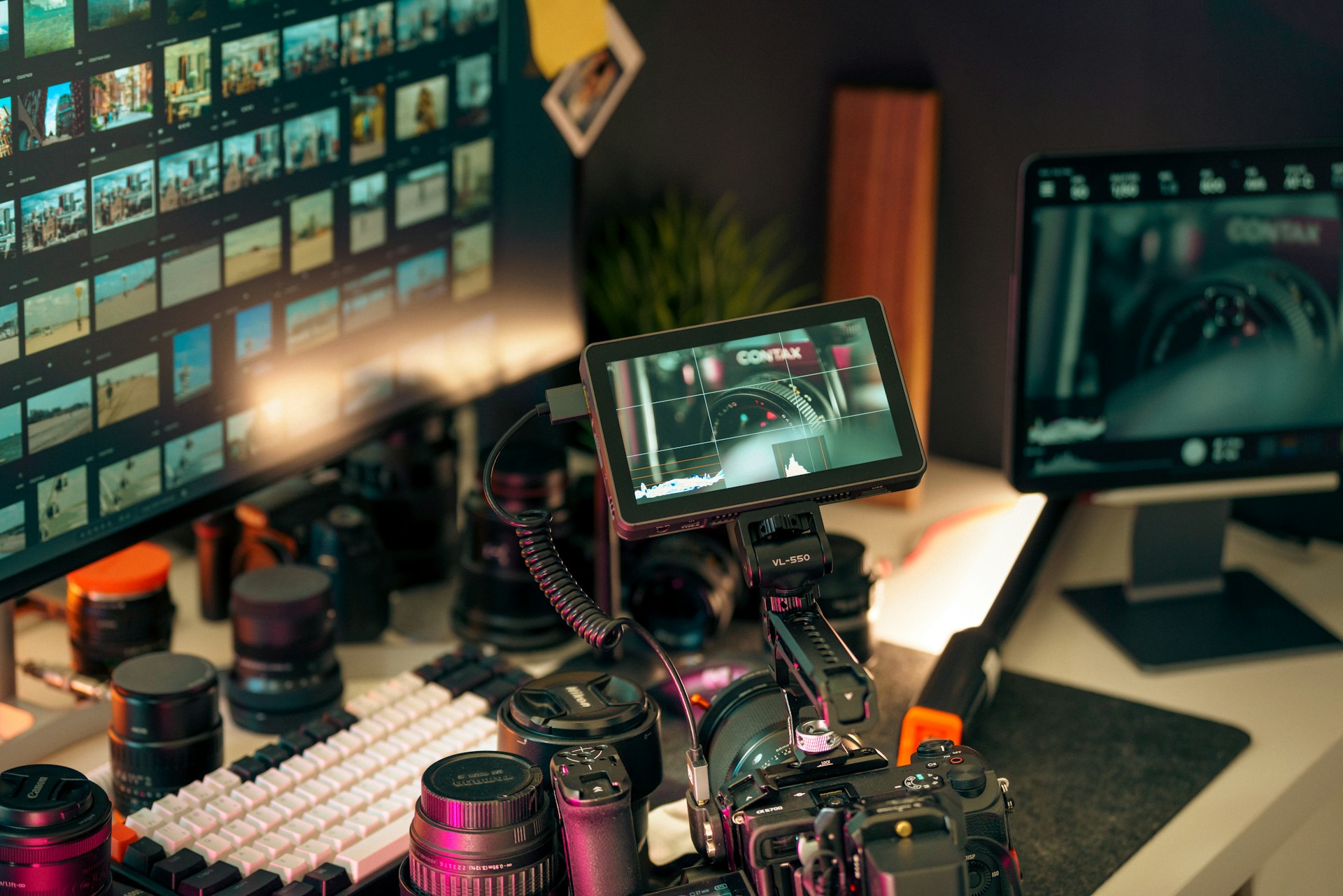 Professional motion design and video editing workstation with cameras and multiple monitors